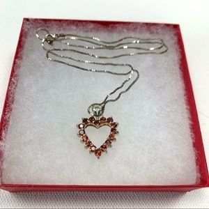 Gold and ruby red heart shaped pendant necklace